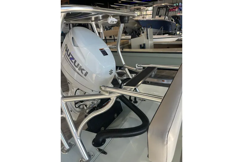 Slide: The Image of 2026 East Cape Evo 17X boat with Suzuki outboard motor in showroom. - 5