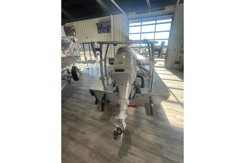 Slide: The Image of 2026 East Cape Evo 17X boat with outboard motor in showroom. - 7