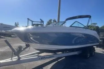 Slide: The Image of 2023 Sea Ray SDX 250 Outboard boat on trailer, sunny day. - 2
