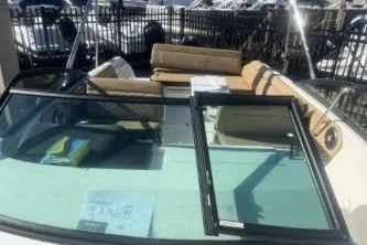 Slide: The Image of 2023 Sea Ray SDX 250 Outboard boat with spacious seating and sleek design. - 9