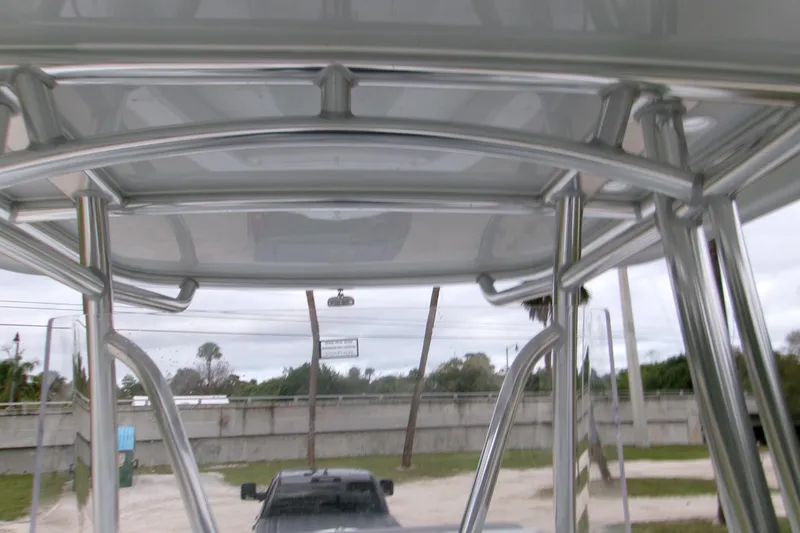 Slide: The Image of 2026 Contender 28 Tournament boat with sleek metal framework and canopy. - 15