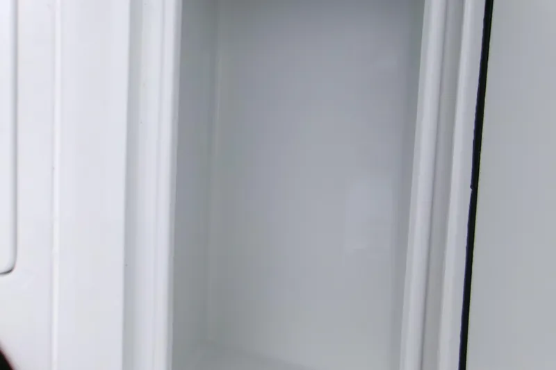 Slide: The Image of Empty storage compartment on 2026 Contender 28 Tournament boat. - 16