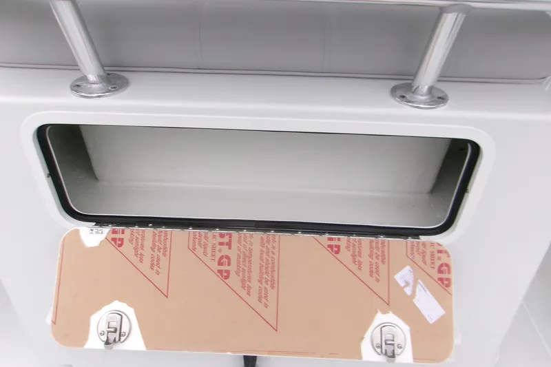 Slide: The Image of Open storage compartment on 2026 Contender 28 Tournament boat. - 17