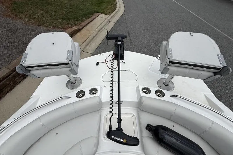 Slide: The Image of Outdoor store with a white SUV parked, featuring 2021 Hurricane SunDeck Sport 201 OB. - 14