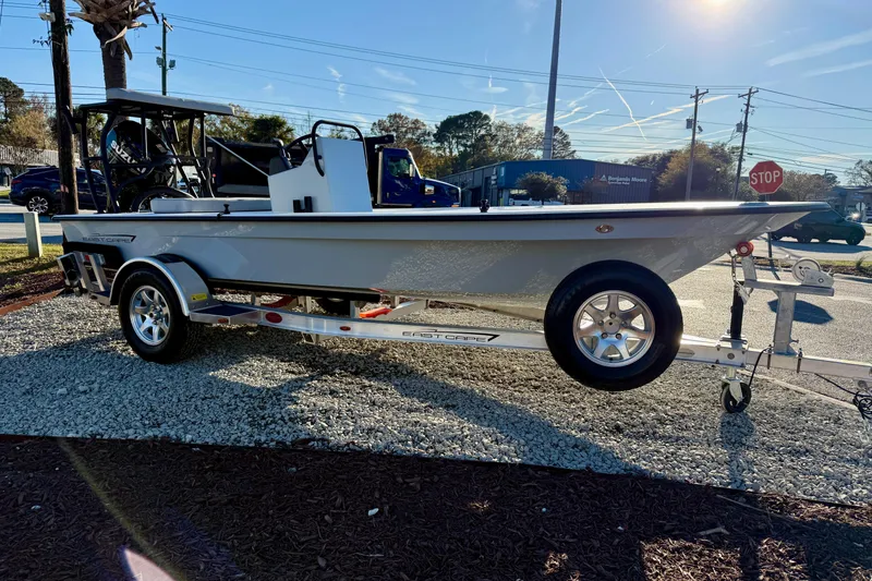 Slide: The Image of 2026 East Cape EVO 17V boat on trailer, parked outdoors in sunlight. - 1