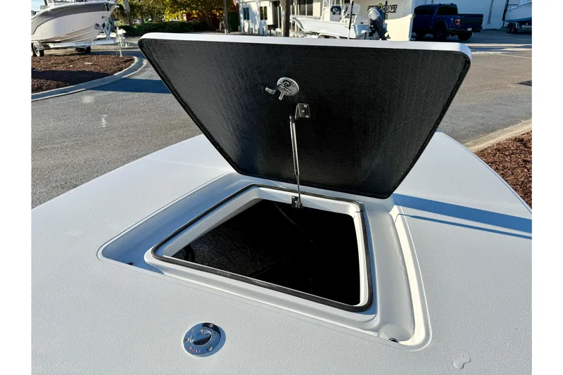 Slide: The Image of Open storage compartment on 2026 East Cape EVO 17V boat deck. - 4