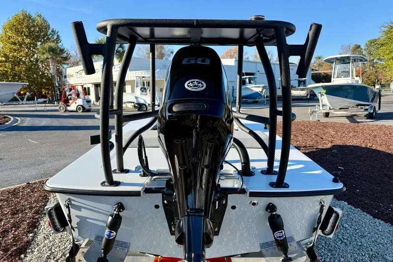 Slide: The Image of 2026 East Cape EVO 17V boat with powerful outboard motor, displayed outdoors. - 10