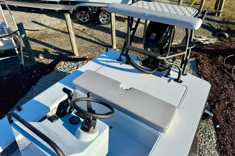 Slide: The Image of 2026 East Cape EVO 17V boat interior with steering wheel and seating. - 12