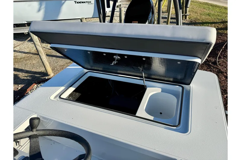 Slide: The Image of Open storage compartment on 2026 East Cape EVO 17V boat, showcasing interior design. - 5