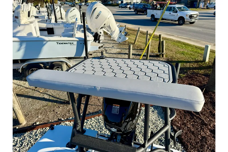 Slide: The Image of 2026 East Cape EVO 17V boat with Yamaha motor, parked near other boats. - 6