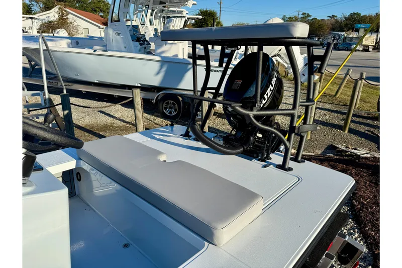 Slide: The Image of 2026 East Cape EVO 17V boat with Suzuki outboard motor, parked outdoors. - 9