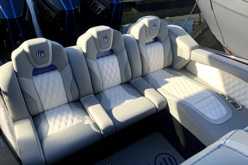 Slide: The Image of Luxurious seating in 2026 Mystic Powerboats M3800, featuring elegant quilted upholstery. - 4