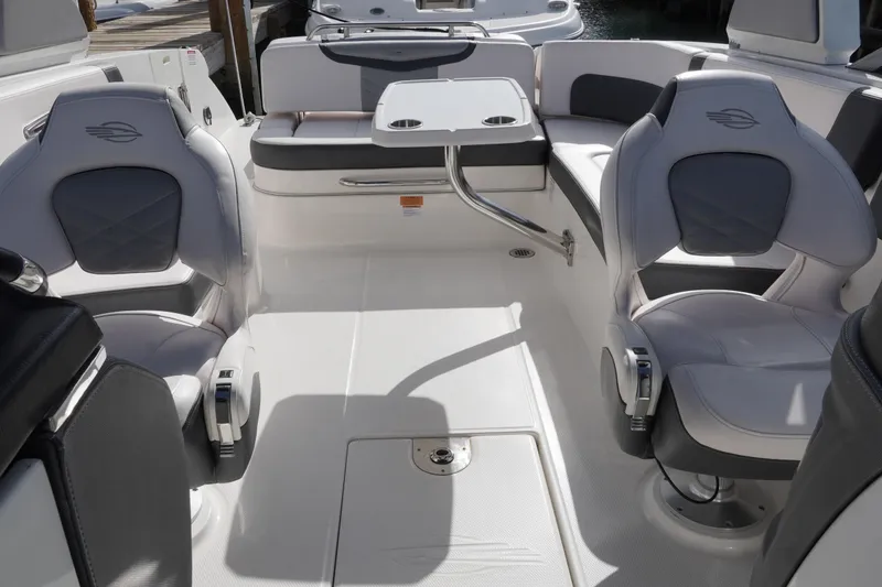 Slide: The Image of 2019 Chaparral 227 SSX boat interior with seating and table setup. - 12