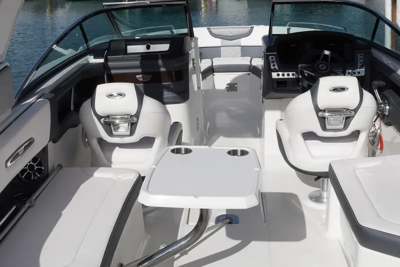 Slide: The Image of 2019 Chaparral 227 SSX boat interior with seating and steering console. - 10