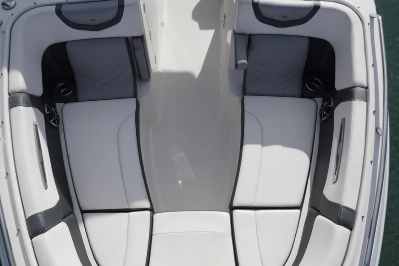 Slide: The Image of 2019 Chaparral 227 SSX boat interior with white and gray seating. - 17