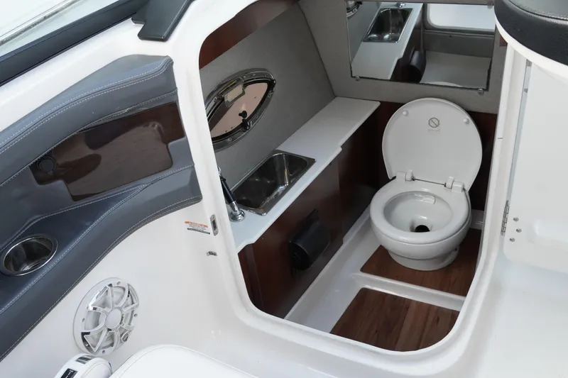 Slide: The Image of 2019 Chaparral 227 SSX boat interior with toilet and sink. - 18
