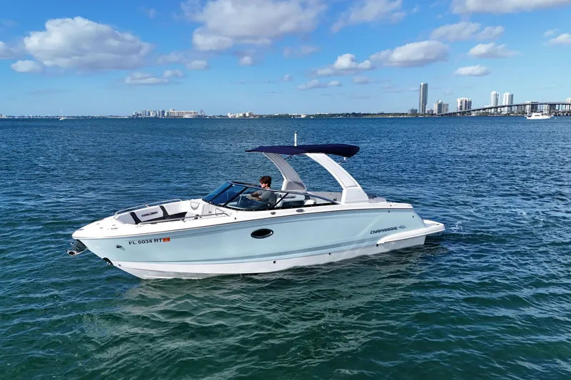 Slide: The Image of 2019 Chaparral 227 SSX boat cruising on blue water under a clear sky. - 3