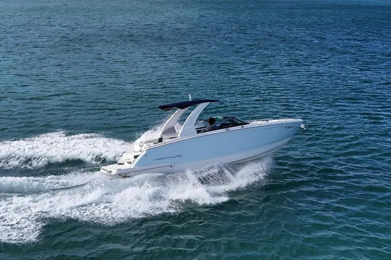 Slide: The Image of 2019 Chaparral 227 SSX speedboat cruising on open water, creating a dynamic wake. - 5