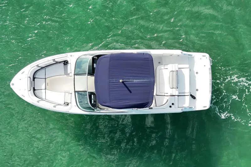 Slide: The Image of Overhead view of 2019 Chaparral 227 SSX boat on clear green water. - 7
