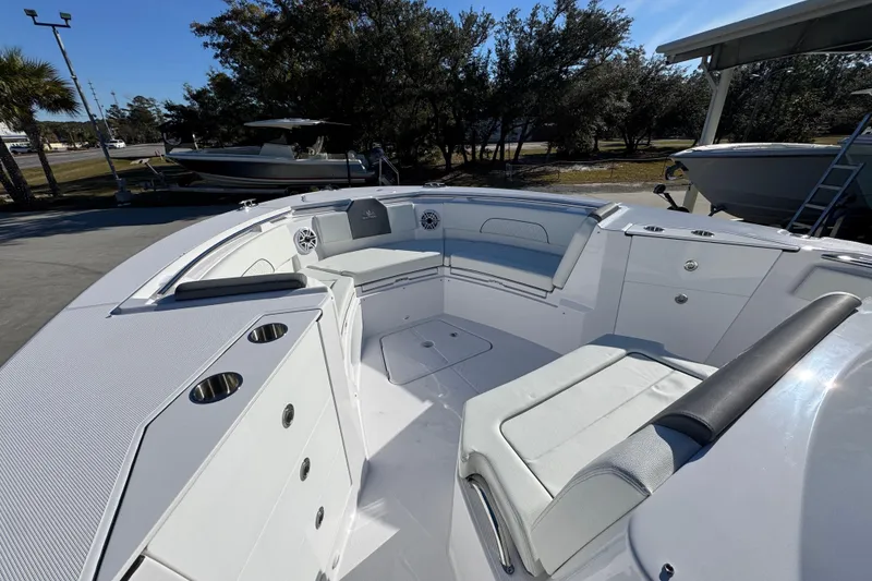 Slide: The Image of 2026 Bertram 34 CC boat interior with seating and cup holders. - 21
