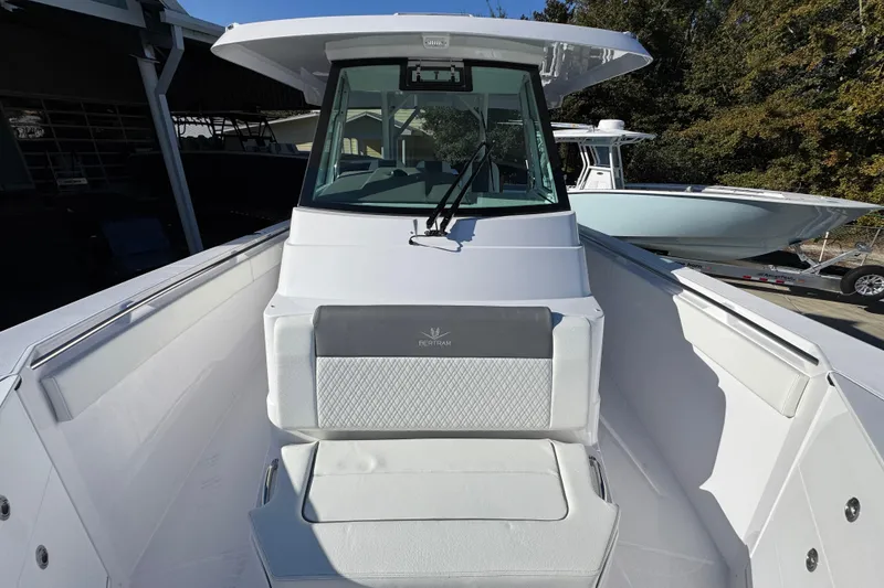 Slide: The Image of 2026 Bertram 34 CC boat with sleek white interior and modern design. - 25