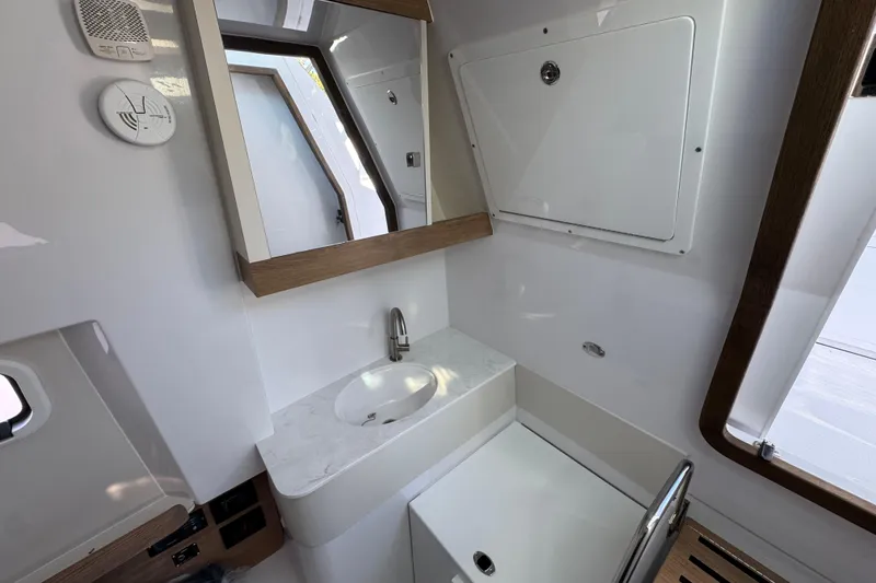 Slide: The Image of Modern bathroom interior of 2026 Bertram 34 CC boat, featuring sleek design and fixtures. - 38