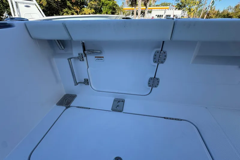 Slide: The Image of 2026 Bertram 34 CC boat interior with storage compartments and sleek design. - 44
