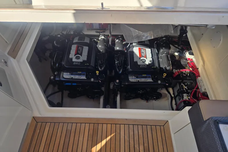 Slide: The Image of Engine compartment of 2017 Sea Ray 310 Sundancer with twin 4.5L engines. - 20