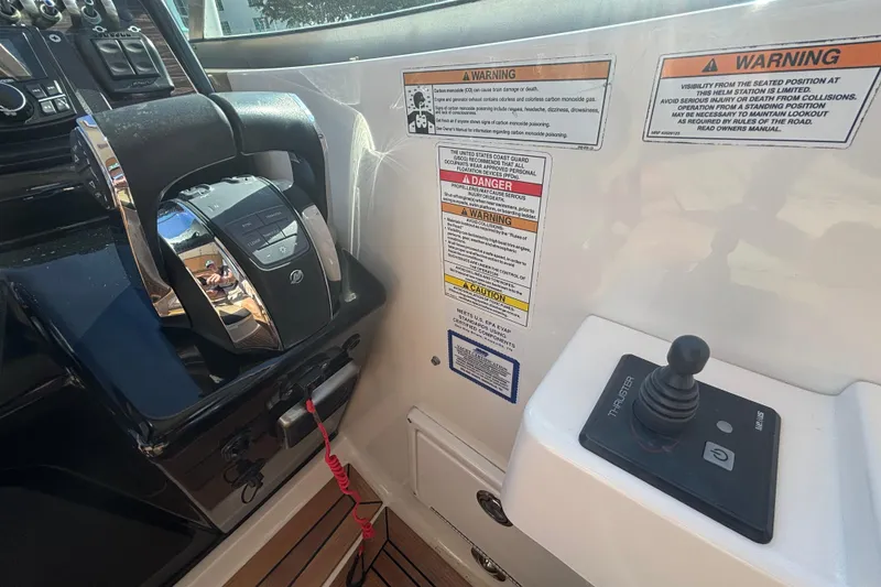 Slide: The Image of Control panel of 2017 Sea Ray 310 Sundancer with throttle and joystick. - 8