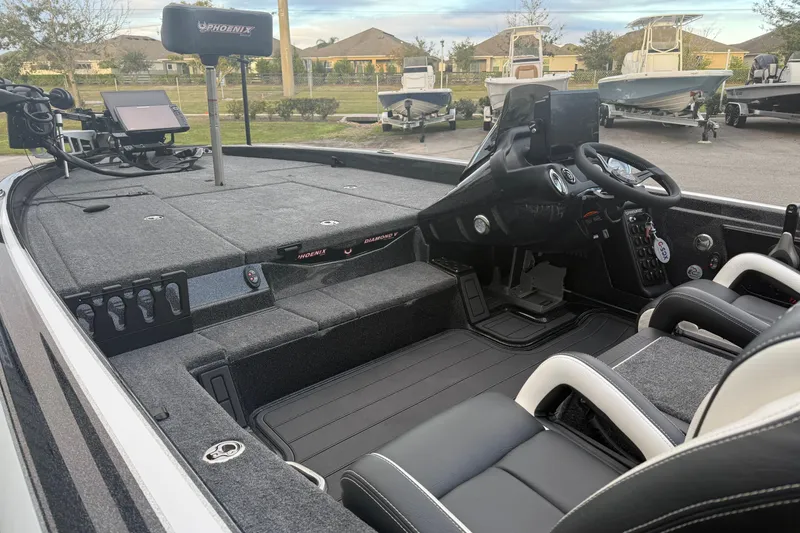 Slide: The Image of Interior of 2025 Phoenix 919 ZXL boat with advanced controls and seating. - 5