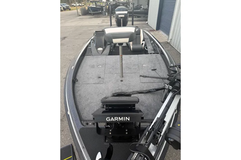 Slide: The Image of 2025 Phoenix 919 ZXL boat with Garmin equipment, docked in a marina. - 7