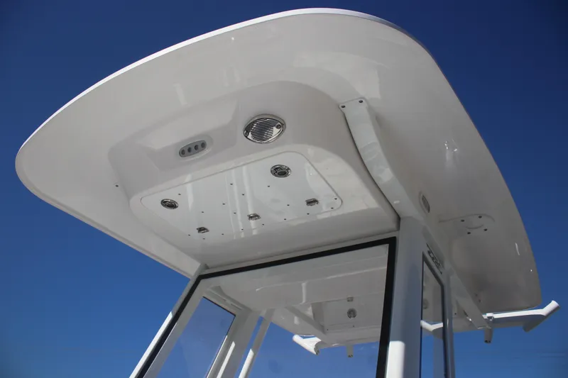 Slide: The Image of 2026 Sea Fox 228 Commander boat roof against clear blue sky. - 11