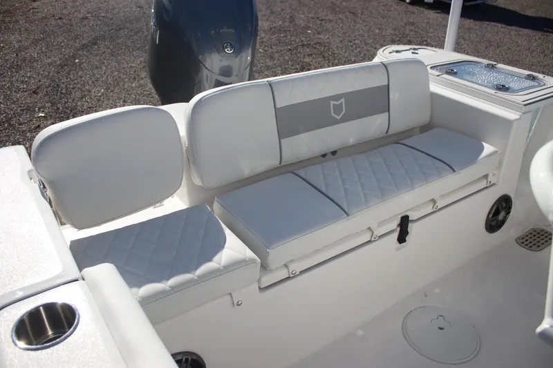 Slide: The Image of 2026 Sea Fox 228 Commander boat interior with cushioned seating and motor. - 23
