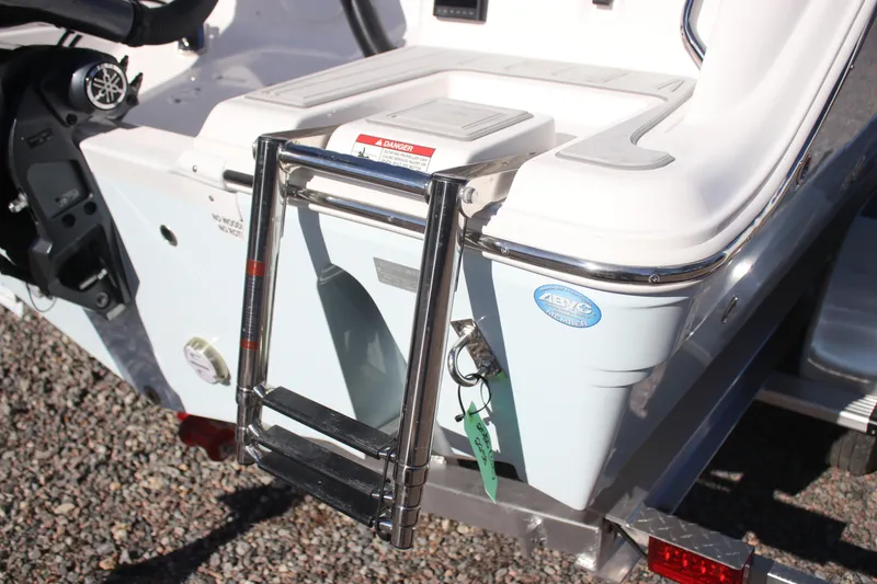 Slide: The Image of 2026 Sea Fox 228 Commander boat with stainless steel ladder and ABYC member badge. - 25