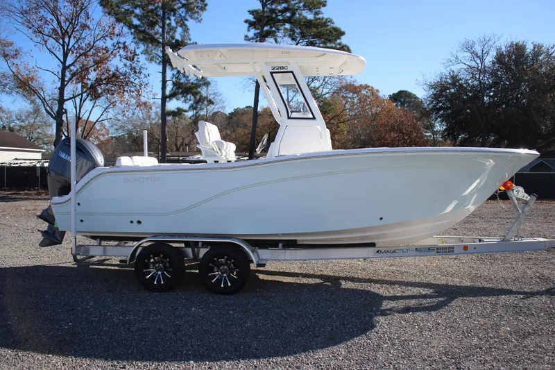 Slide: The Image of 2026 Sea Fox 228 Commander boat on trailer, parked outdoors. - 6