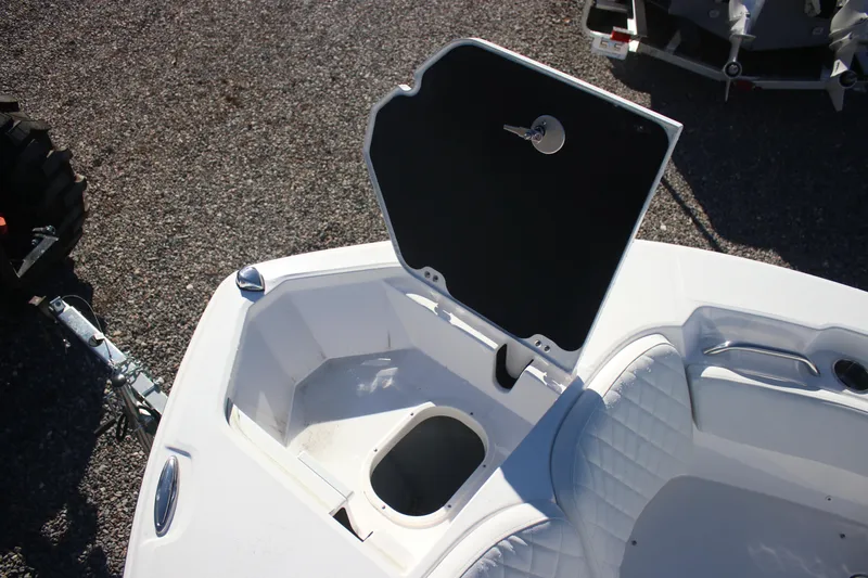 Slide: The Image of 2026 Sea Fox 228 Commander boat storage compartment with open hatch and seating. - 9