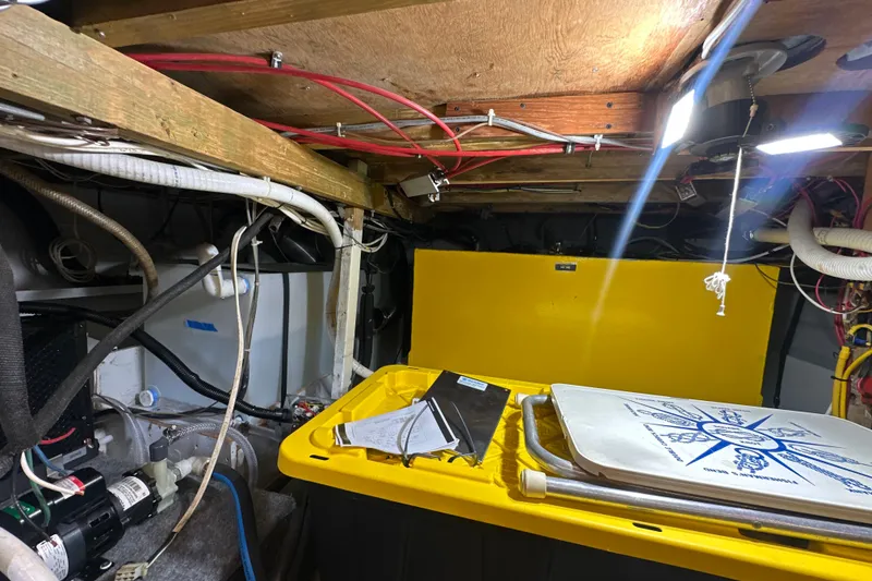 Slide: The Image of Engine room of a 1985 Pearson 43 Trawler with equipment and wiring. - 66