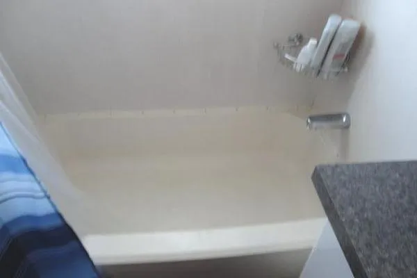 Slide: The Image of 1985 Pearson 43 Trawler bathroom with shower, curtain, and toiletries. - 15