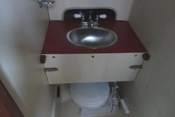Slide: The Image of 1985 Pearson 43 Trawler bathroom with sink and toilet. - 33