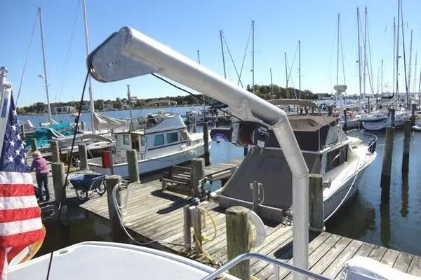 Slide: The Image of 1985 Pearson 43 Trawler docked at a marina with other boats. - 35