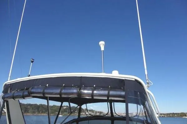 Slide: The Image of 1985 Pearson 43 Trawler with antennas against clear blue sky. - 40