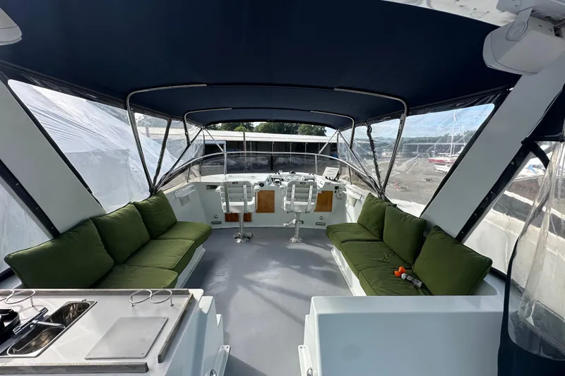 Slide: The Image of Interior view of 1985 Pearson 43 Trawler with green seating and helm station. - 41