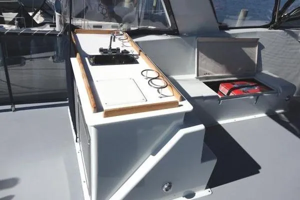 Slide: The Image of 1985 Pearson 43 Trawler deck with sink and storage compartments, featuring modern design elements. - 42