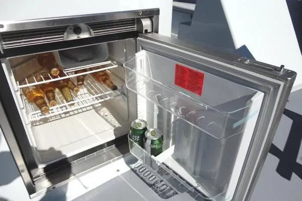 Slide: The Image of Open fridge on 1985 Pearson 43 Trawler with drinks inside. - 44
