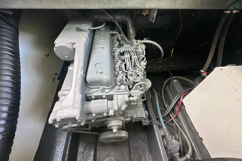 Slide: The Image of Engine compartment of a 1985 Pearson 43 Trawler, showcasing detailed mechanical components. - 59