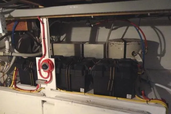 Slide: The Image of Engine room of 1985 Pearson 43 Trawler with battery setup and wiring. - 63