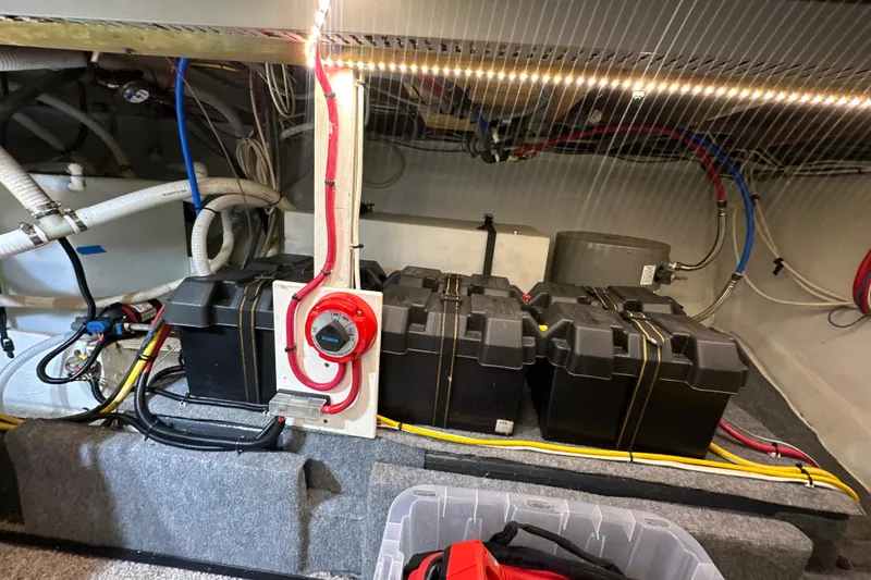 Slide: The Image of Electrical system in 1985 Pearson 43 Trawler engine room with batteries and wiring. - 64