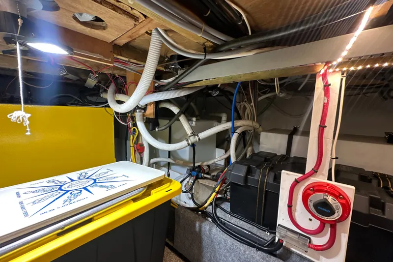 Slide: The Image of Engine room of a 1985 Pearson 43 Trawler with wiring and equipment. - 65