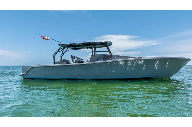 The Image of Custom 2026 boat with 45 Cummins Diesels on clear blue water. - 0