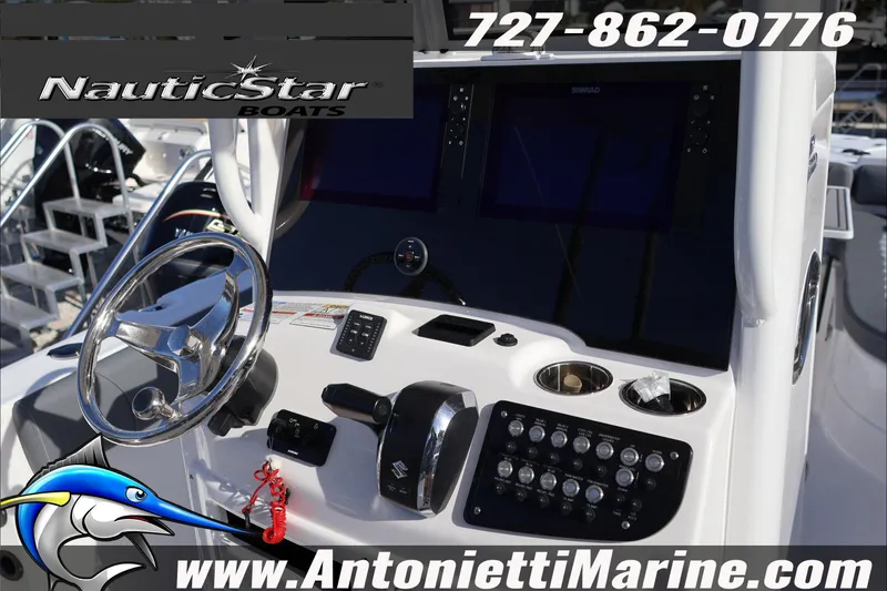 Slide: The Image of 2026 NauticStar 251 Hybrid boat dashboard with steering wheel and controls. - 17